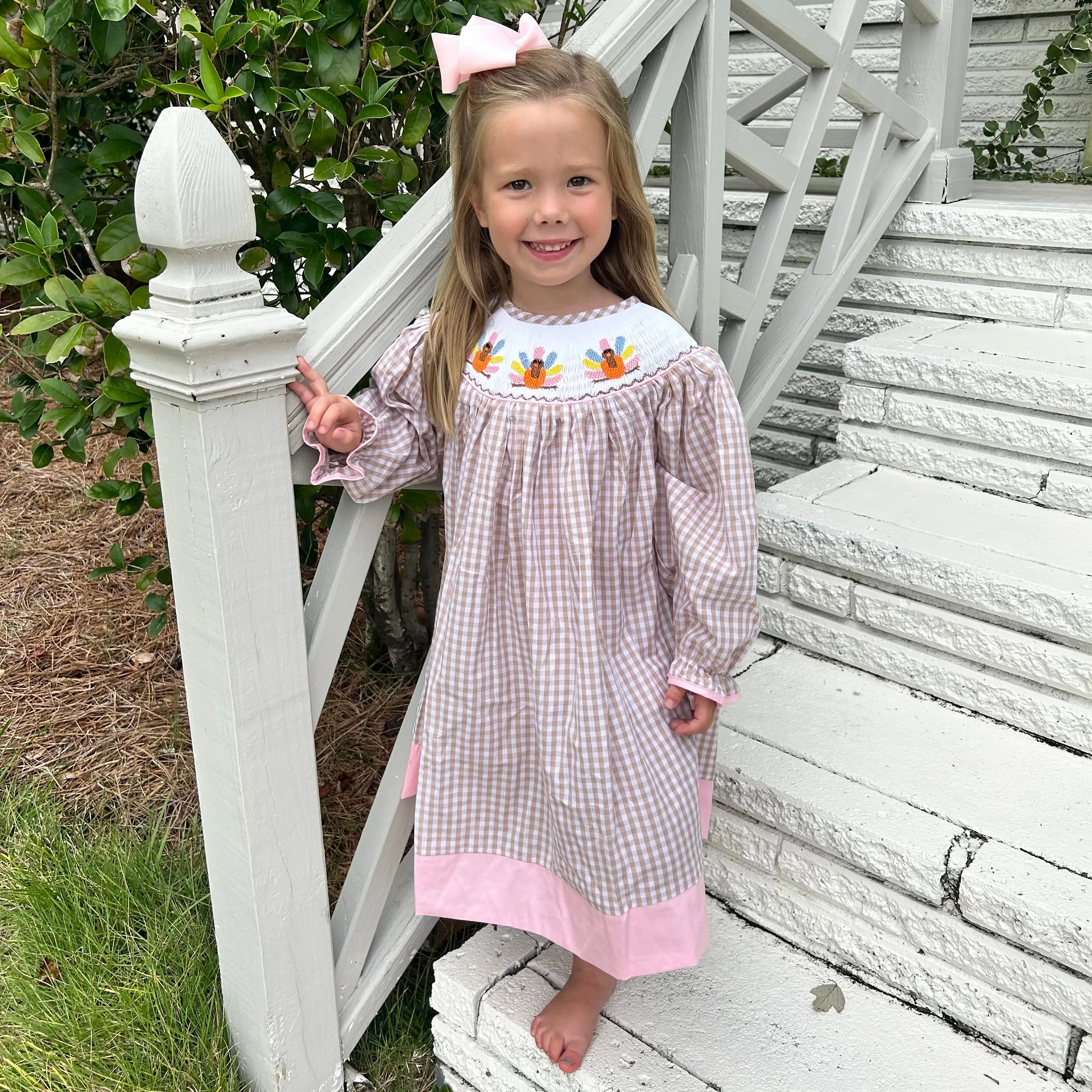 Smocked Turkey Bishop Dress in Tan and Pink!